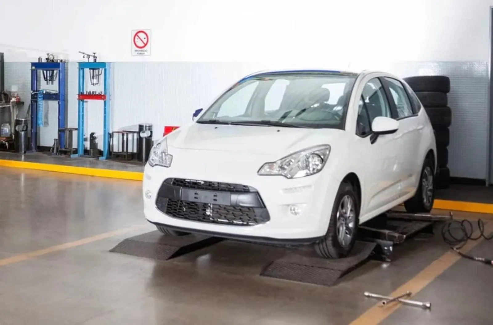 Vehicle being inspected in a collision repair facility
