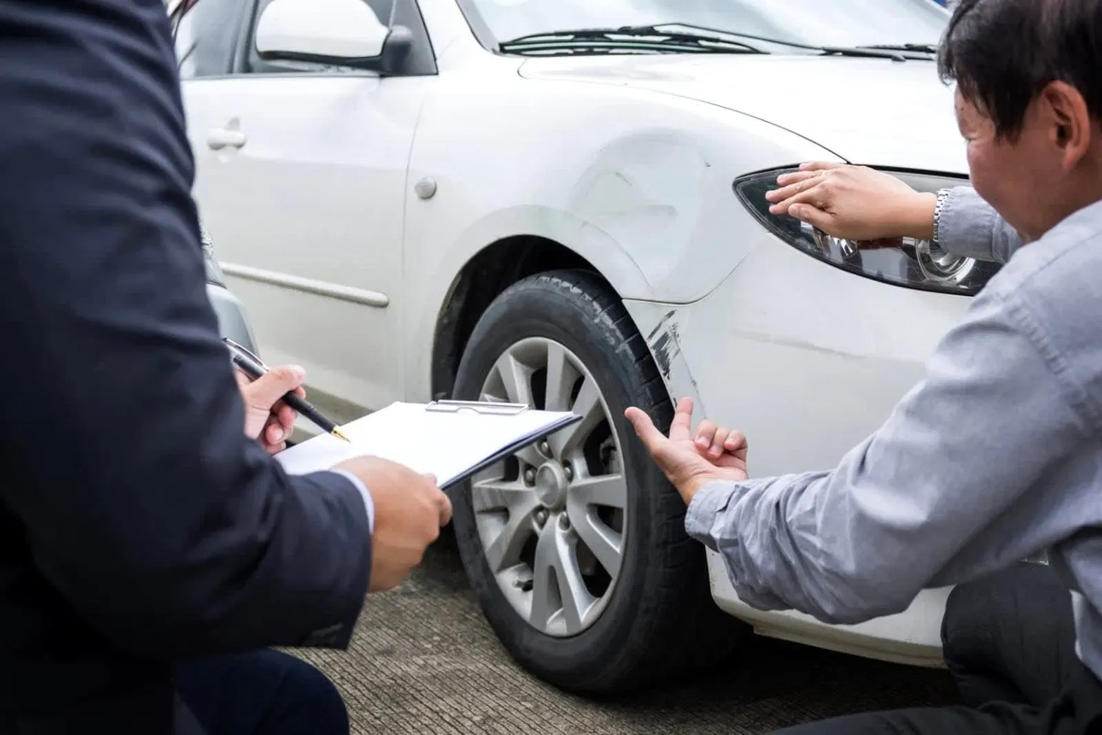 Independent appraiser documenting vehicle damage